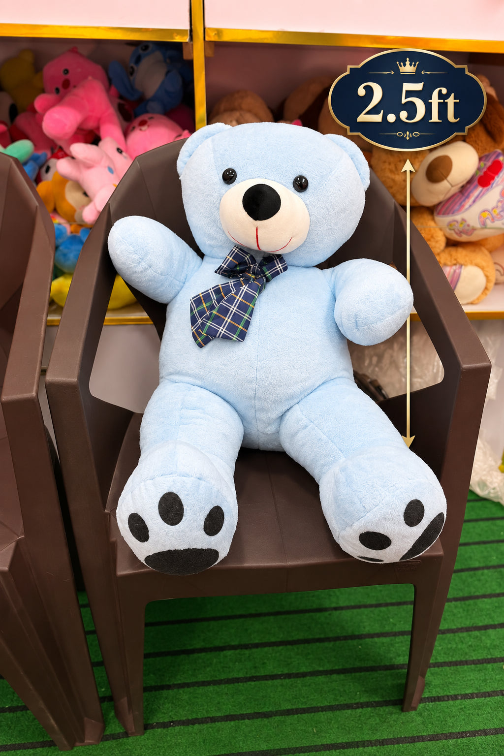 A light blue plush teddy bear with a plaid bow tie - Lahore Toy Box